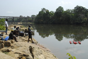 The team is using cable to conduct ADCP discharge measurement on the Lofa River at Lofa Bridge